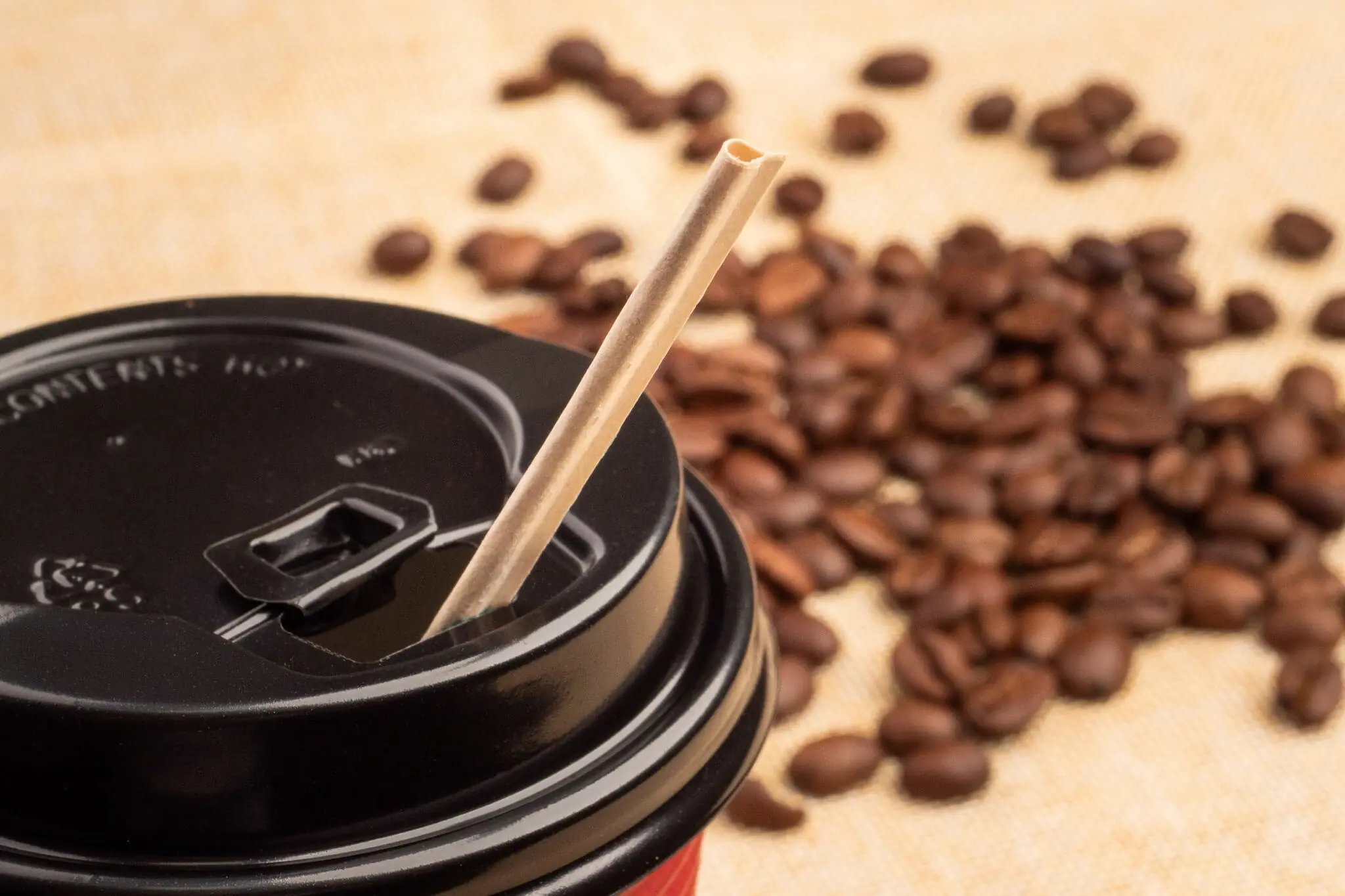 Disposable-paper-straw-inserted-in-coffee-cup
